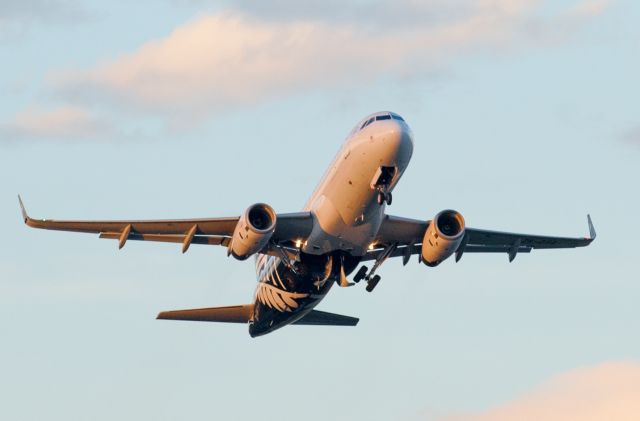 Airbus A320 (ZK-OXA) - A nice shiny AirNZ Airbus A320 climbs away from Runway 20 into the setting sun, bound for Auckland.