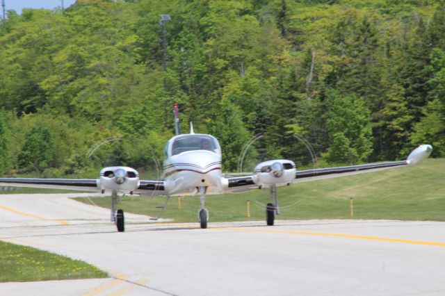 Cessna 310 (N4258C) - Taxiing to runway 8 at Mackinac Island, flying back to Ludington    (KLDM) on 6/27/16