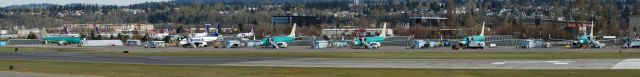 — — - Various Boeing aircraft in different stages of assembly at Boeing Field