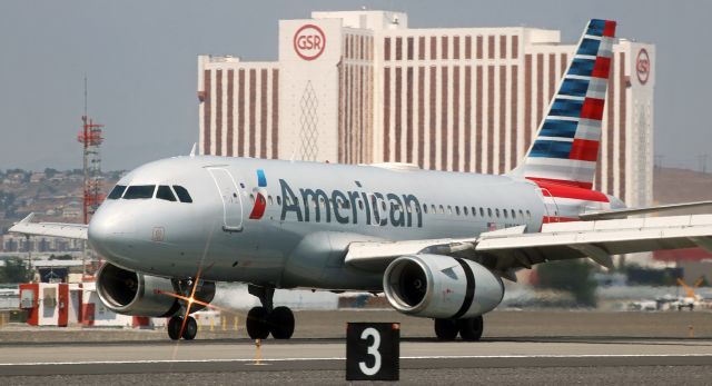 Airbus A319 (N807AW) - Down on 16L at 11:47 AM and deploying the thrust reversers and spoilers to begin slowing, AAL's N807AW completes a late morning flight from Phoenix (PHX).