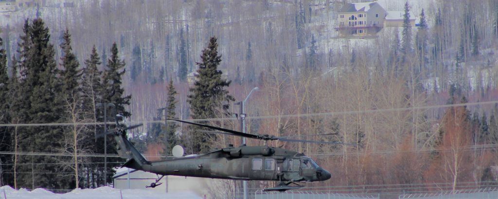 — — - Blackhawk lifting off.