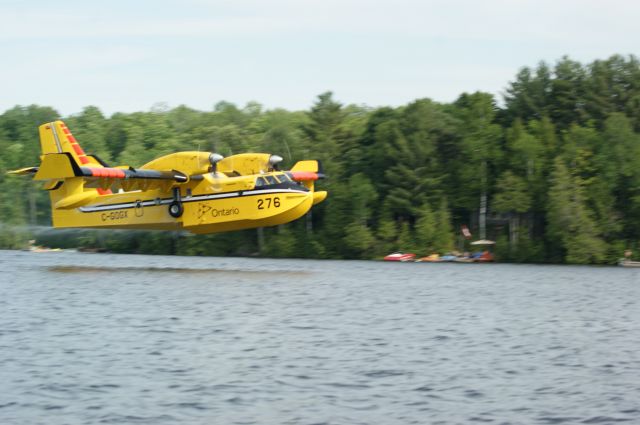 Canadair CL-41 Tutor (C-GOGX) - Crystal Lake, Ontario taken from our boat we had an awesome view as two SuperScoopers fought a nearby forest fire we could not see.