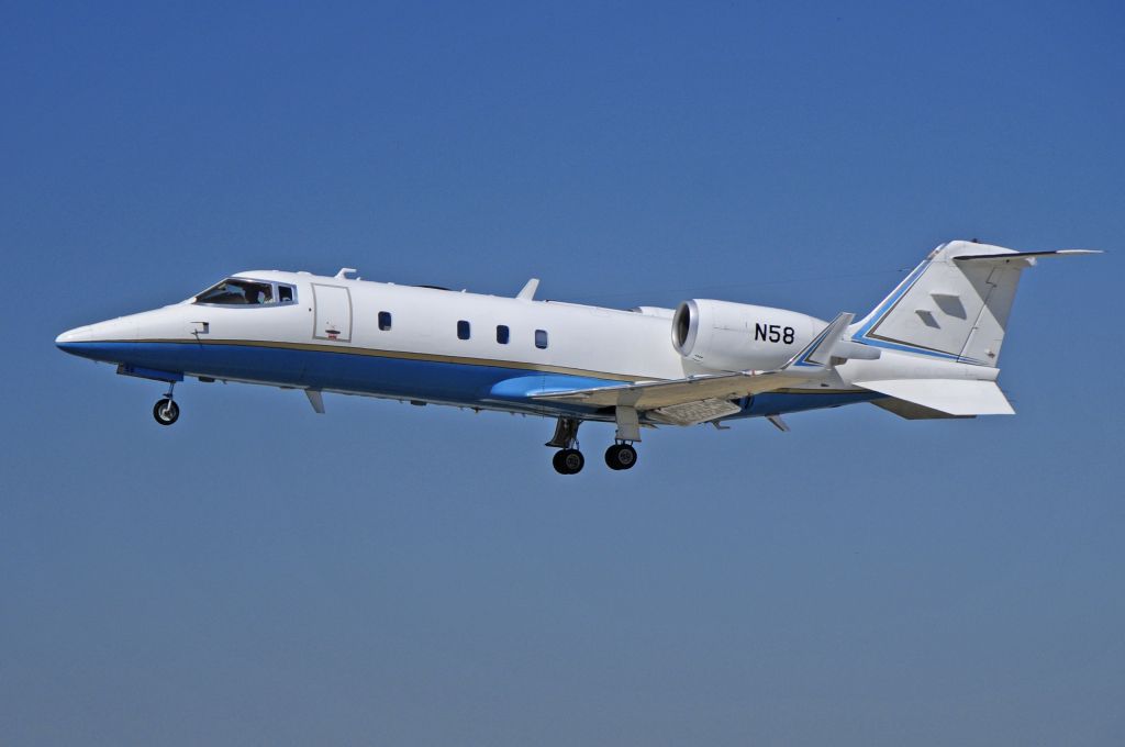 Learjet 60 (N58) - FAA flight check on runway one-two, Merced Regional Airport (KMCE)