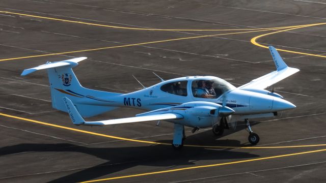 Diamond Twin Star (ZK-MTS) - ZK-MTS Taxing out of the Massey Apron seen from the Palmerston North Airport tower