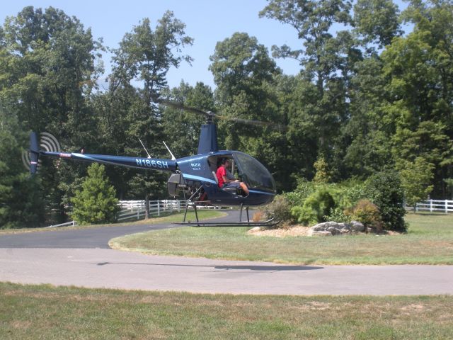 Robinson R-22 (N186SH) - Tim Brumitt hovering in his driveway 2010