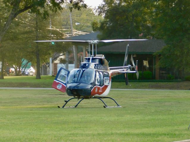 Bell JetRanger (N539AE) - Air Evac 87 in the grass at Bolivar Medical Center getting ready to move to the helipad after waiting for Pafford Air One Echo to move