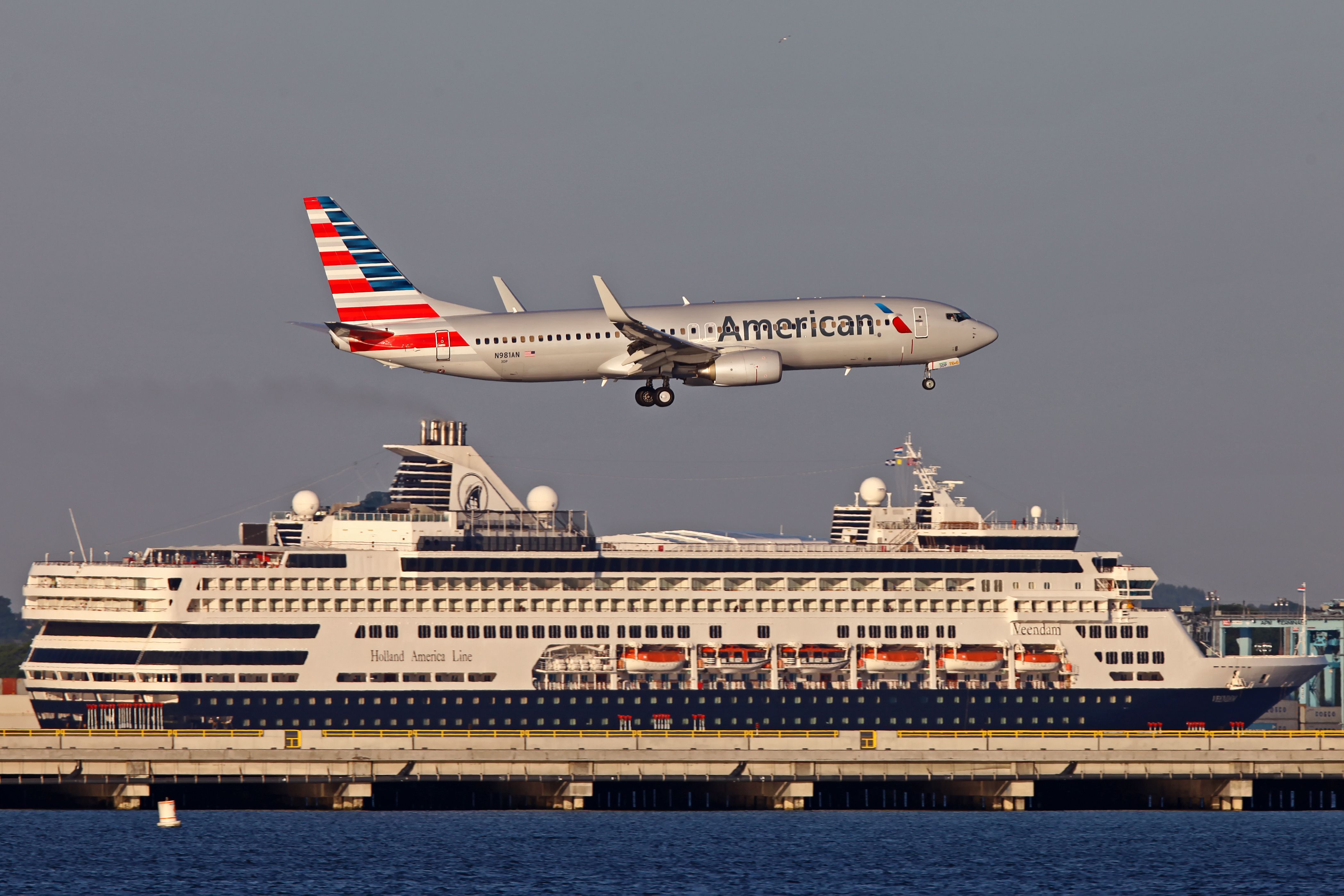 Boeing 737-800 (N981AN) - The cruise ship arriving at the cruise terminal in Boston makes the perfect backdrop for this AA 737 landing on 33L at KBOS. 