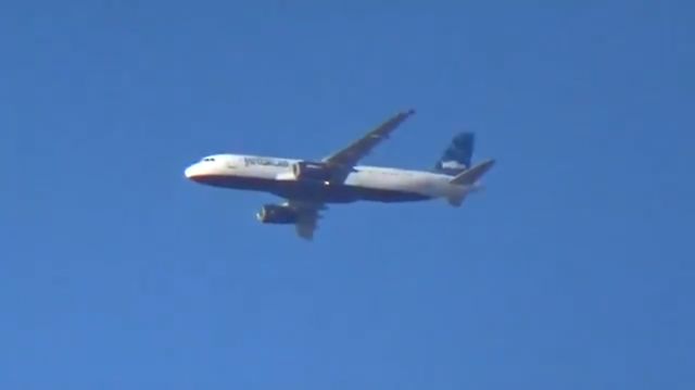 Airbus A320 (N554JB) - Caught while watching a football practice.