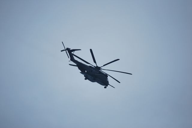 — — - Sikorsky CH-53E flying over Cape Henry Light House in Virginia in May 2010