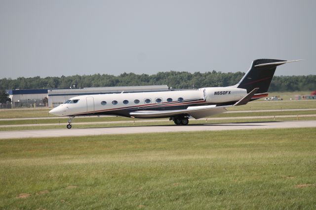 Gulfstream Aerospace Gulfstream G650 (N650FX) - Gulfstream 650 flying into Grand Rapids. Photo taken at the observation deck.