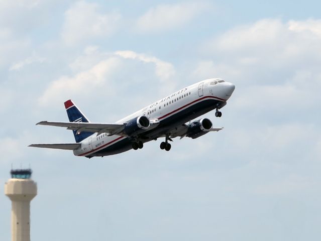 Boeing 737-700 (N419US) - Take off runway 10L.