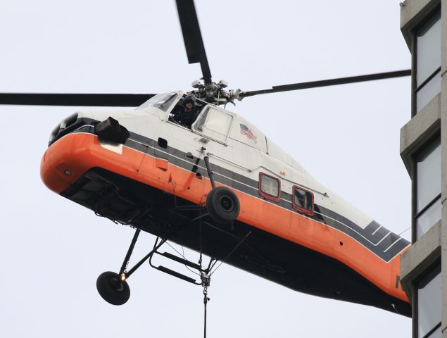 Aerospatiale Dauphin 2 (SA-365C) (N4247V) - Delivering A/C chillers to rooftop of 405 N Wabash Ave. Downtown Chicago. Photo from Wabash..