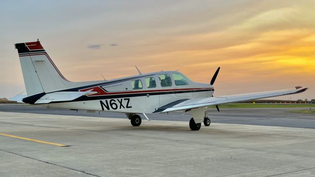 Beechcraft Bonanza (36) (N6XZ) - A Bonanza on the ramp at Kentland Municipal in the closing minutes of the sunset. br /br /This aircraft is a 1982 Beechcraft A36 Bonanza, SN E-2047, owned by Kahler Automation Corp. 10/13/22. 