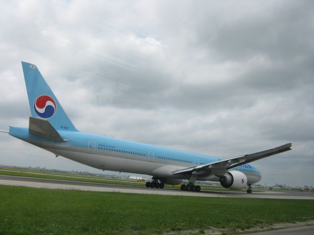 BOEING 777-300 (HL8217) - On a airside tour  at Toronto Pearson international Airport driving along side a Korean Air 777.