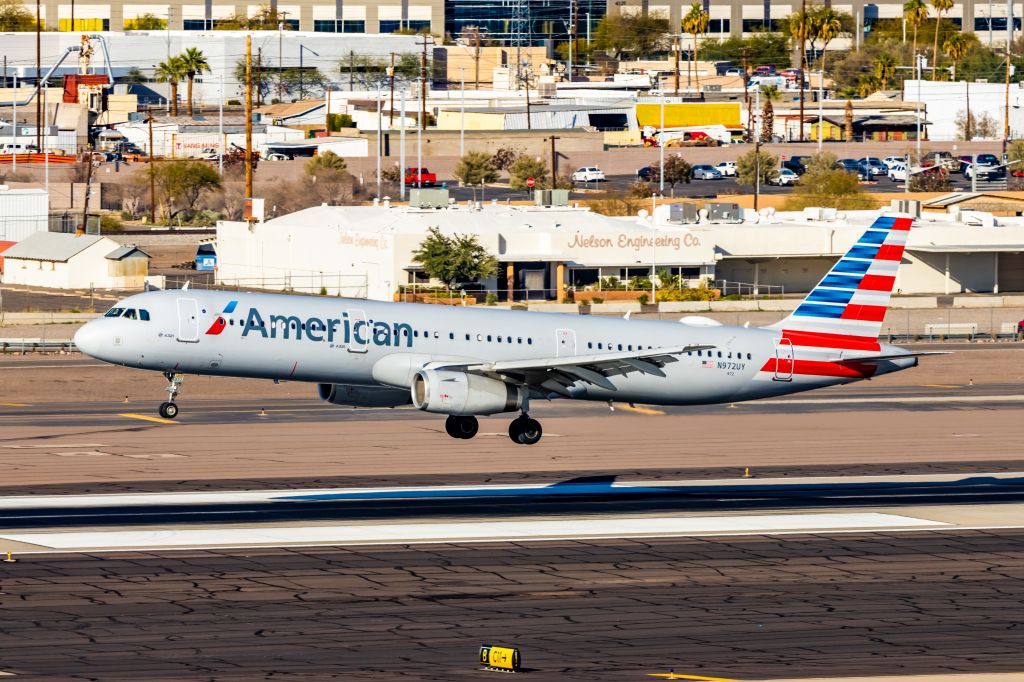 Airbus A321 (N972UY) - An American Airlines A321 landing at PHX on 2/4/23. Taken with a Canon R7 and Tamron 70-200 G2 lens.