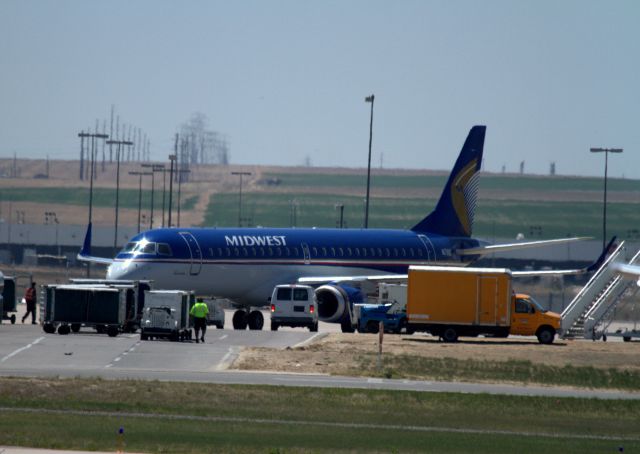 Embraer 170/175 (N171HQ) - I took this at Denver International while waiting to board a jet to Rapid City, SD. I have no idea what they were doing. Filming a commercial or movie maybe?