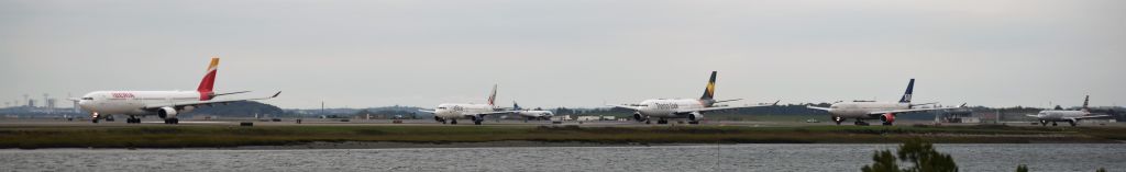 — — -  Iberia, jetBlue, Thomas Cook, SAS, and American making  up part of the evening line up on taxiway November. 