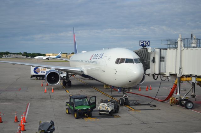 BOEING 767-300 (N196DN) - N196DN (B767-332ER) at gate F10 after landing from Honolulu at 5:30 (The next flight was to back to Honolulu, then to Tokyo, and back to Honolulu, then to LA, and JFK.) The Alaska in the background is N275AK, a B737-990ER landing from Anchorage.br /br /Taken 07:44, July 1, 2024