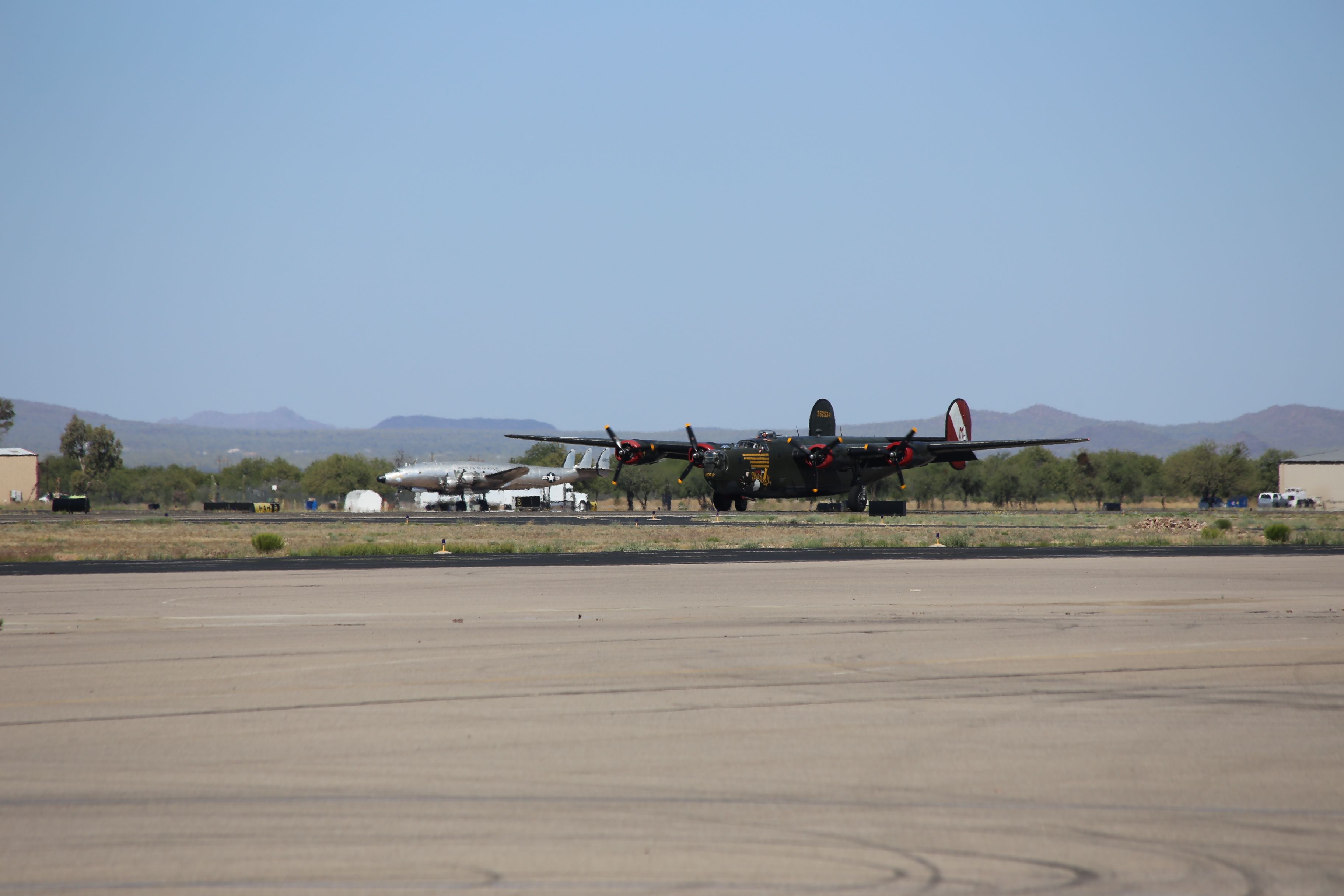 Consolidated B-24 Liberator (N224J) - Collings Foundation Consolidated Liberator B-24J, Witchcraft, on 18 April 2015.  Eisenhowers Constellation, VC-121A-LO, Columbine II, SN: 48-0610, is seen in the background.