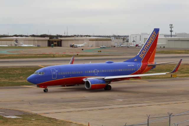 Boeing 737-700 (N487WN) - Southwest Airlines (WN) N487WN B737-7H4 [cn33854]. Dallas Love Field (DAL).  Southwest Airlines flight WN401 taxis for departure to Salt Lake City (SLC) during a busy day for this frame flying 7 sectors covering 4,975 miles travelling across the Eastern US starting at Bradley 05h50 and ending at St Louis 23h11. The sectors covered; BDL-MCO, MCO-BHM, BHM-DAL, DAL-SLC, SLC-DEN, DEN-MDW, MDW-STL.br /Wearing Southwest’s Canyon Blue Livery introduced in 2001 and since September 2014 is being replaced by the Heart livery.   Taken from 4th Floor, Short Stay Car Park A.    2017 12 07   a rel=nofollow href=http://alphayankee.smugmug.comhttps://alphayankee.smugmug.com/a