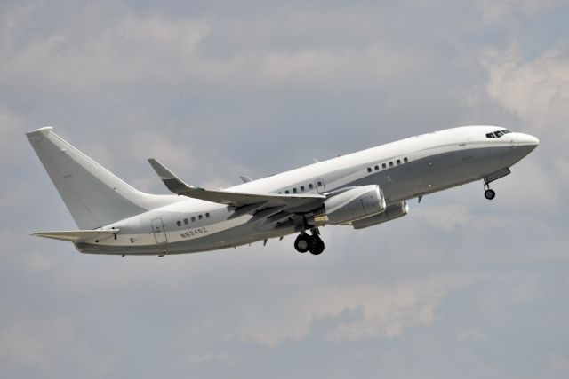 Boeing 737-700 (N834BZ) - BBJ Ship #1. Departing 23-L on 04-21-21 bound for VNY after a couple month stay at IND. Perfect camouflage paint scheme for an overcast day. 