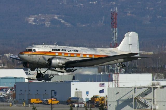 Douglas DC-3 (N777YA) - Bush Air Cargo DC-3 seen departing PANC back to its home base of Palmer, Alaska.