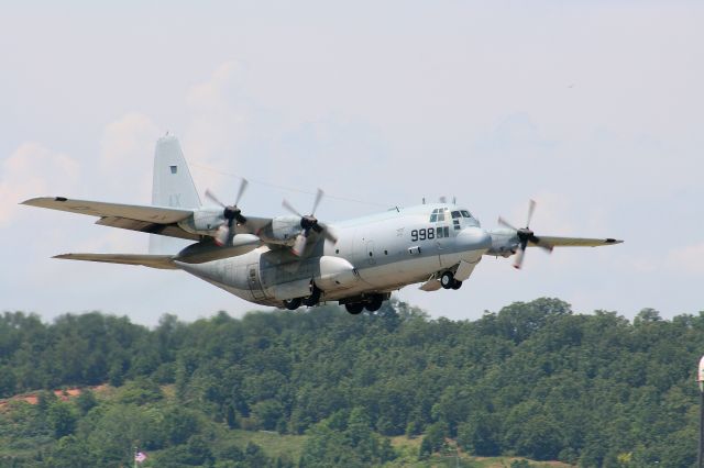 — — - A USN KC-130 from VR-53 climbs out of Fort Smith.