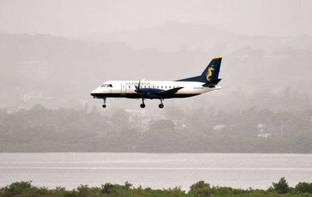 Saab 340 (N283AE) - On final for runway 8, TSJS. Taken from the Intercontinental Hotel, Carolina, PR. 8/12/13