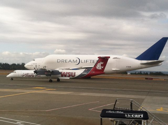 de Havilland Dash 8-100 (N401QX) - The Dream Lifter was photographed taxiing beside one of our college painted Q400's.