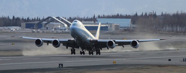 Boeing 747-400 (N499MC) - Takeoff from Anchorage International Airport today on a windy day allowed this one to kick up some dust as it powered into the air. 10-30-12