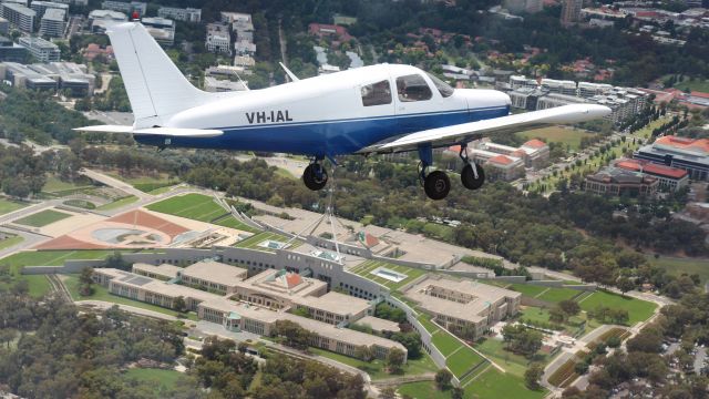 Piper Cherokee (VH-IAL) - Cherokee Cruiser, VH-IAL, flies over Parliament House in Canberra, Australia on 13 Jan 2022.