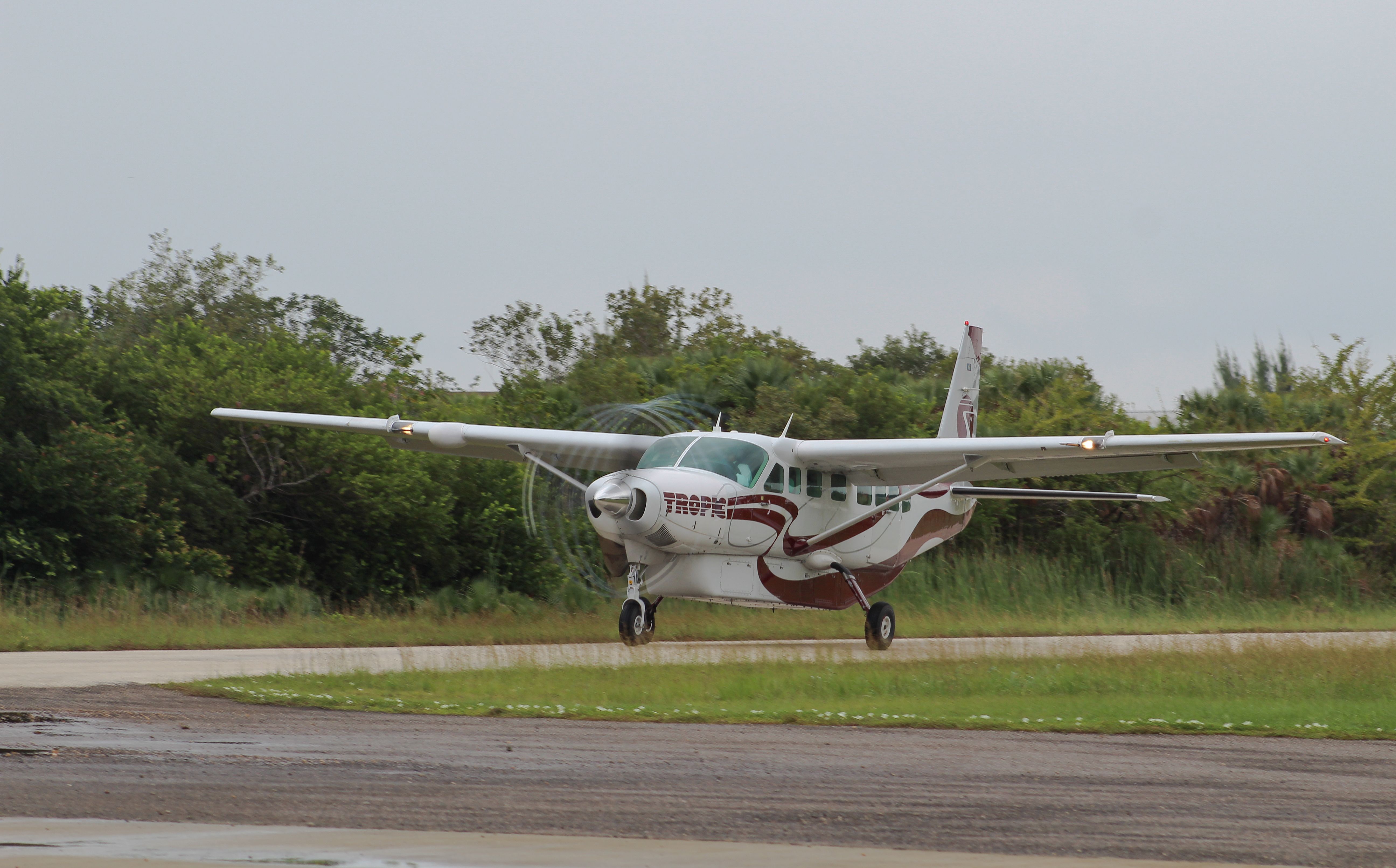 Cessna Caravan (V3-HHE) - Takeoff at Placencia Airstrip.