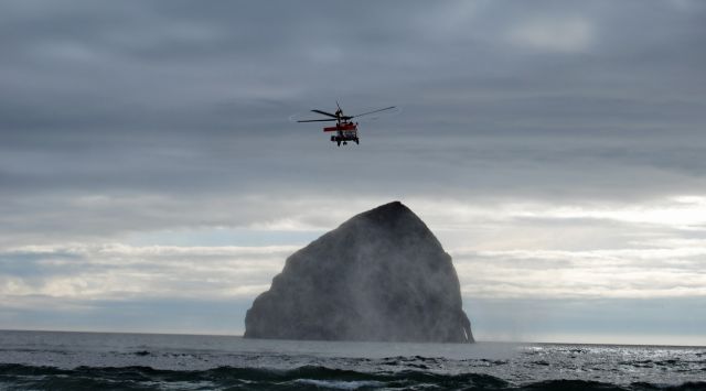 USCG — - United States Coast Guard performing a search and rescue in Pacific City Oregon.