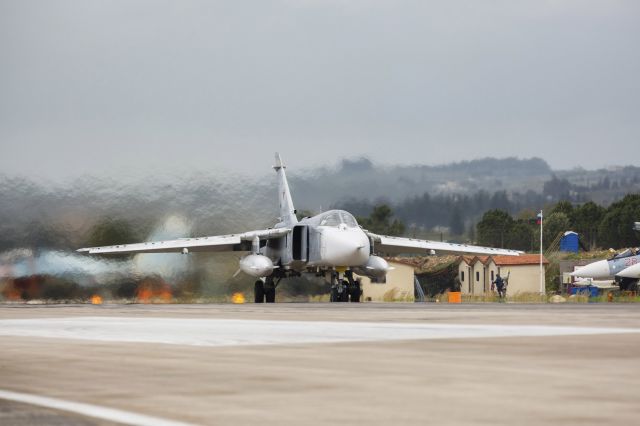 — — - A Russian Sukhoi Su-24 front-line bomber is seen on a runway shortly before taking off, part of the withdrawal of Russian troops from Syria, at Hmeymim airbase, Syria, March 16, 2016. (Photo by Vadim Grishankin/Reuters/Russian Ministry of Defence)