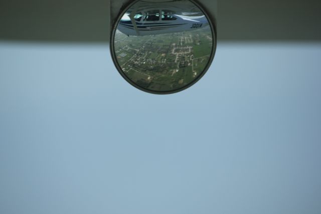 Cessna Skylane (N10GL) - A view of our Cessna 182RG from outboard mirror while airborne over Fayetteville AR.