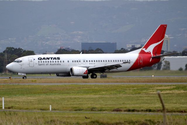 BOEING 737-400 (VH-TJE) - On taxi-way heading for Terminal 1 after landing on runway 23. Friday 5th October 2012.