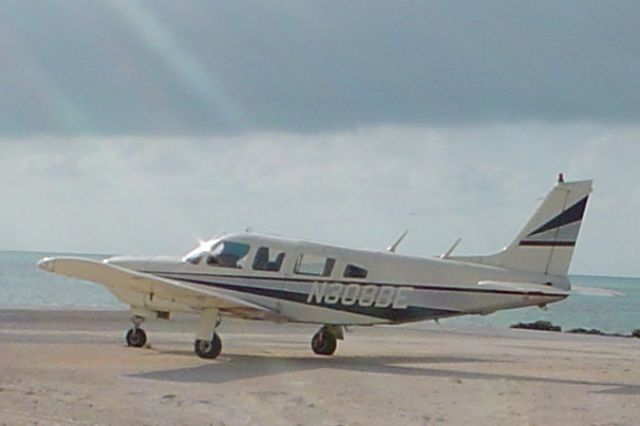 Piper Saratoga (N308BE) - Parked at Farmers Cay Airport, Exumas, Bahamas