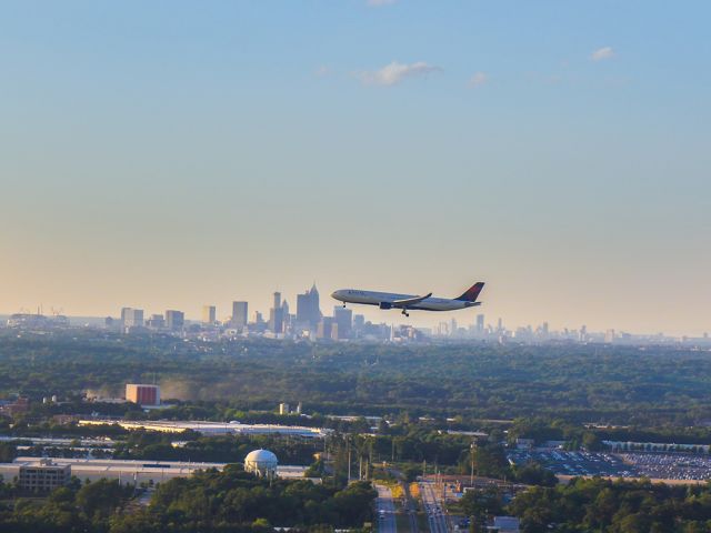 — — - Delta 767 on final with the Atlanta skyline in the background. Can see the construction of the new Mercedes Benz stadium as well. Questions about this photo can be sent to Info@FlewShots.com