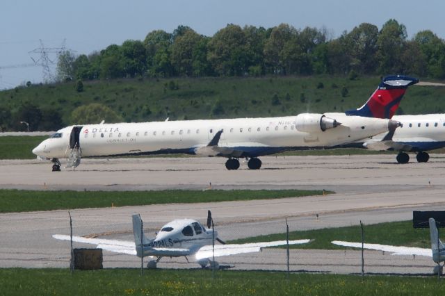 Canadair Regional Jet CRJ-200 (N678CA) - Parked next to the Cirrus delivery center during the great pandemic of 2020, along with dozens of others