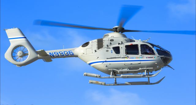 Eurocopter EC-635 (N9906) - N9906 with some Navy colors beloning to a nay looking kinda ship with the same colors heading to the helipad at TNCM St Maarten.