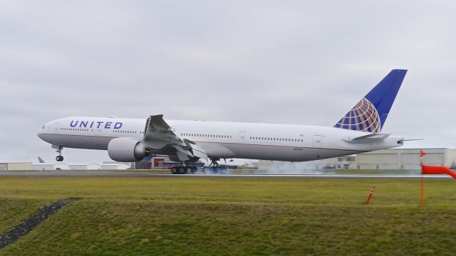 BOEING 777-300 (N2332U) - BOE752 touching down on Rwy 34L to complete a B1 flight on 12.13.16. (ln 1461 / cn 62644).