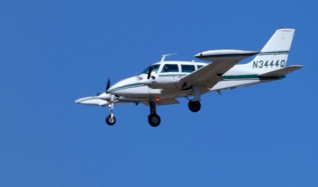 Cessna Executive Skyknight (N3444Q) - On final is this 1966 Cessna 320E Twin Turbo-Prop Executive Skyknight in the Winter of 2019.