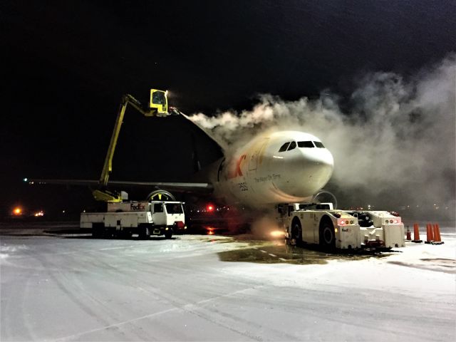 Airbus A300F4-600 (N654FE) - Deicing underway with Type 1 Propylene Glycol at Appleton International after an early November 4" snowfall. 