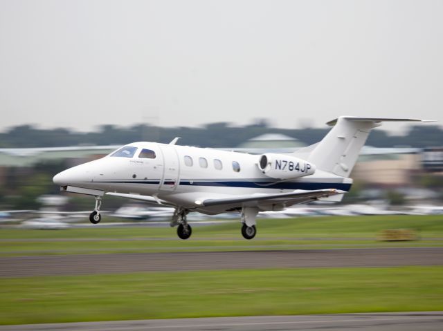 Embraer Phenom 100 (N784JP) - Take off runway 26.