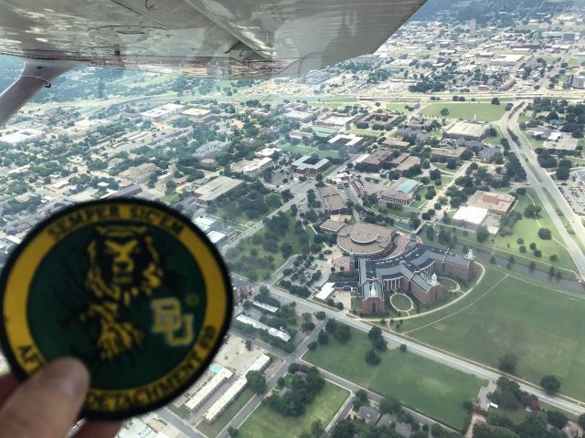 — — - Baylor University Air Force ROTC Detachment 810 unit patch with Baylor University buildings in background. These were cadet orientation flights in support of AFROTC.