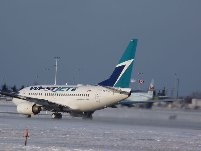 BOEING 737-600 (C-GWSK) - taking off of #32 with a northerly head wind of 26km