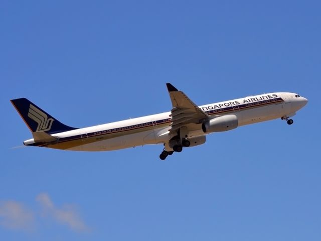 Airbus A330-300 (9V-STQ) - Getting airborne off runway 23 and heading home to Singapore. Monday 19th Dec. 2011