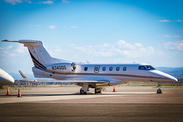 Embraer Phenom 300 (N340QS) - On the ramp at KBJC.