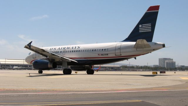 Airbus A319 (N821AW) - Holding short of RWY 19R