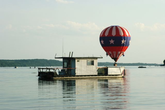 — — - Hot air Balloon Skims Green Lake, WI USA